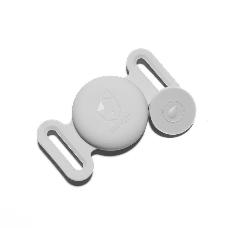 Grey Apple AirTags dog collar holder, with BAUMUTT logo on the front. Flat front view with closing piece taken out and in view