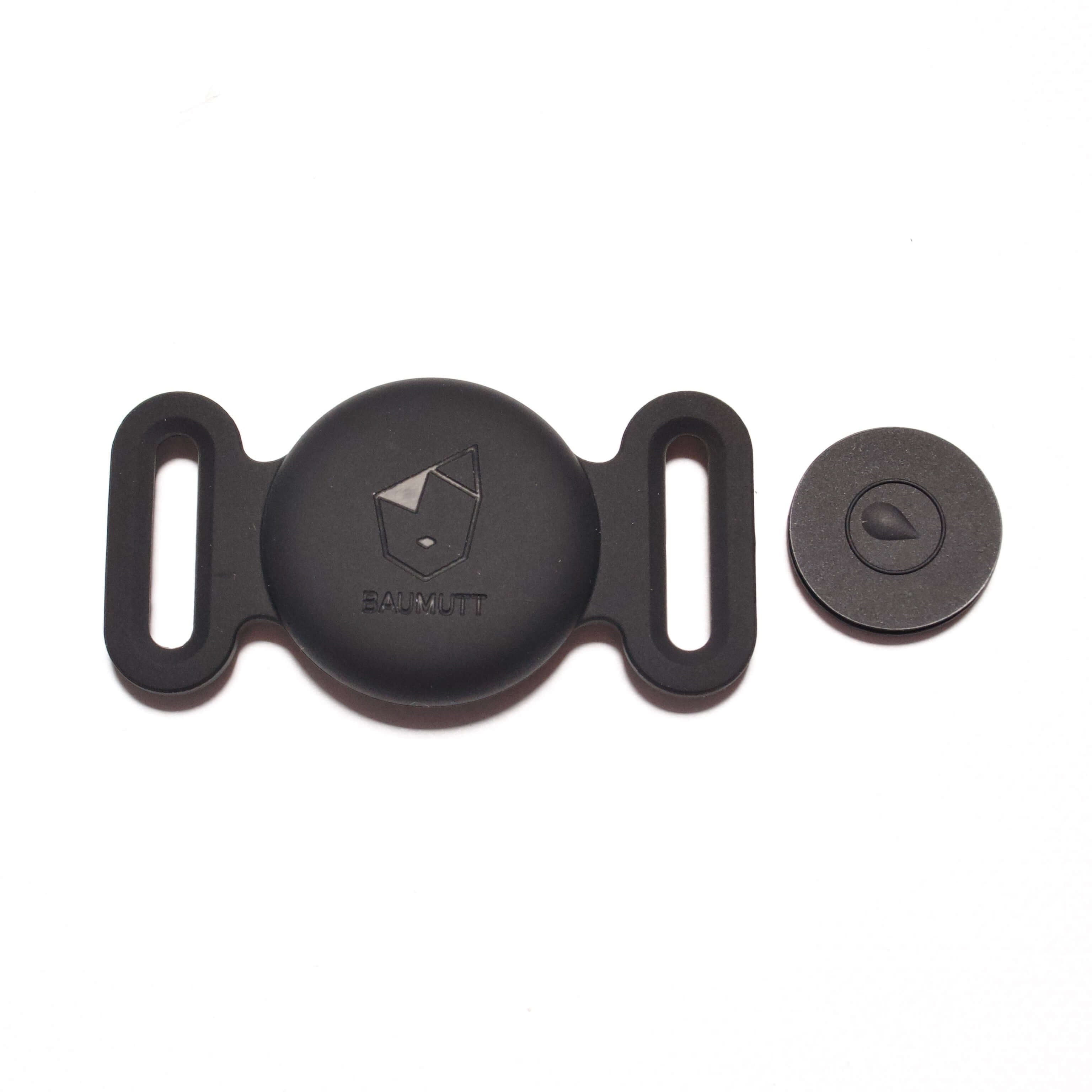 Black Apple AirTag dog collar holder, with BAUMUTT logo on the front. Flat front view with closing piece taken out and in view